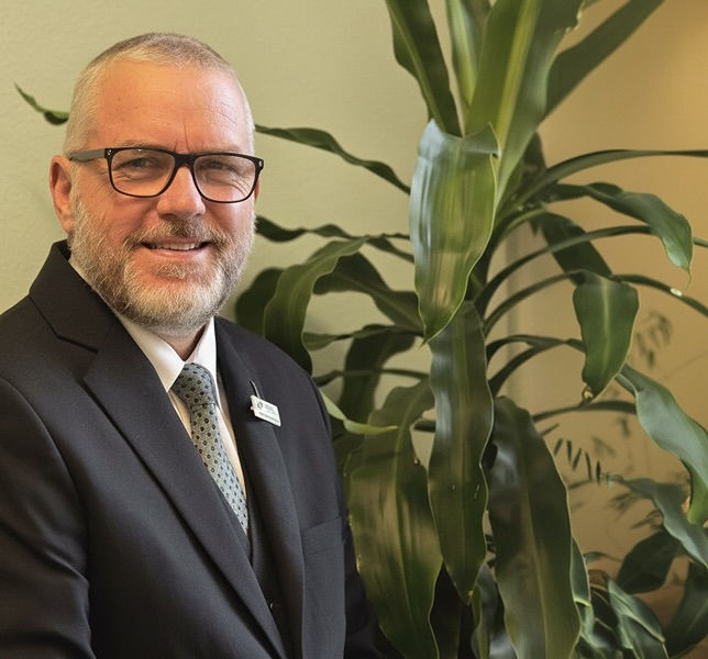 funeral director helping family